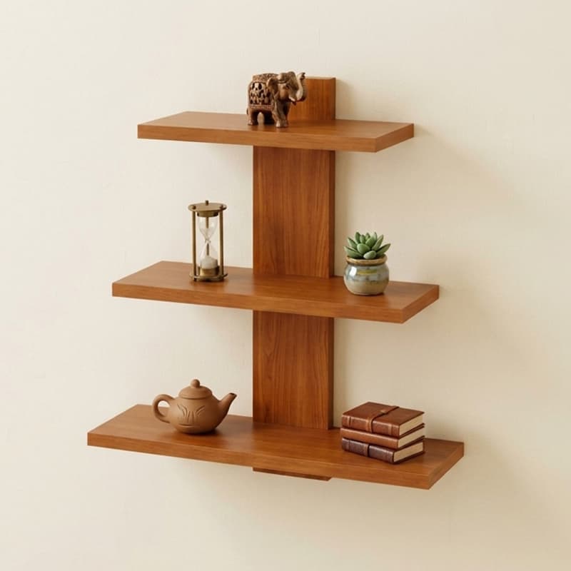 Teak wall shelf with three planks of increasing width on a central spine, holding a teapot, hourglass and books