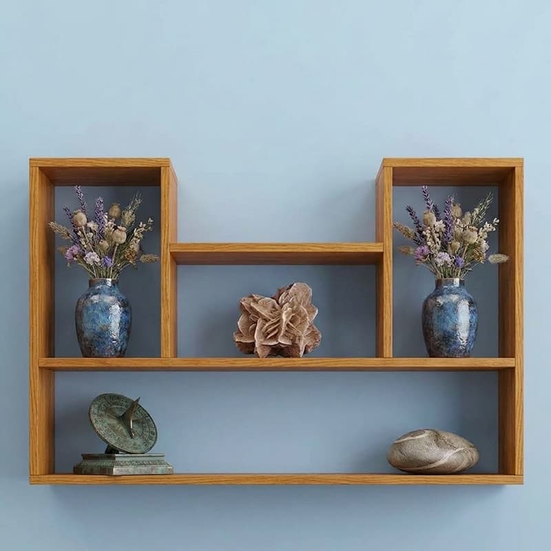 Oak gallery wall shelf with two tall end cubbies, a low centre ledge and a full-width base holding vases and ornaments